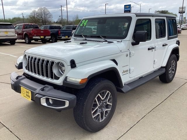 2024 Jeep Wrangler Sahara in Whi — front three-quarter view